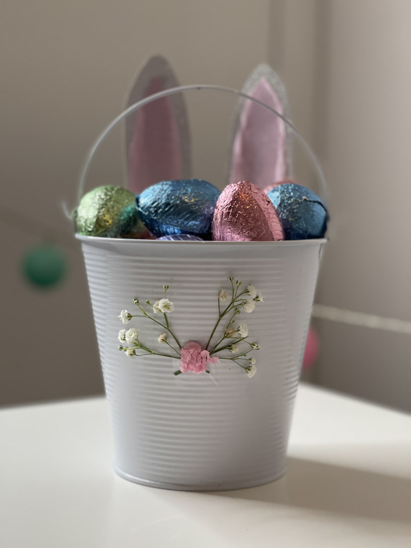 Easter bunny basket filled with chocolate eggs