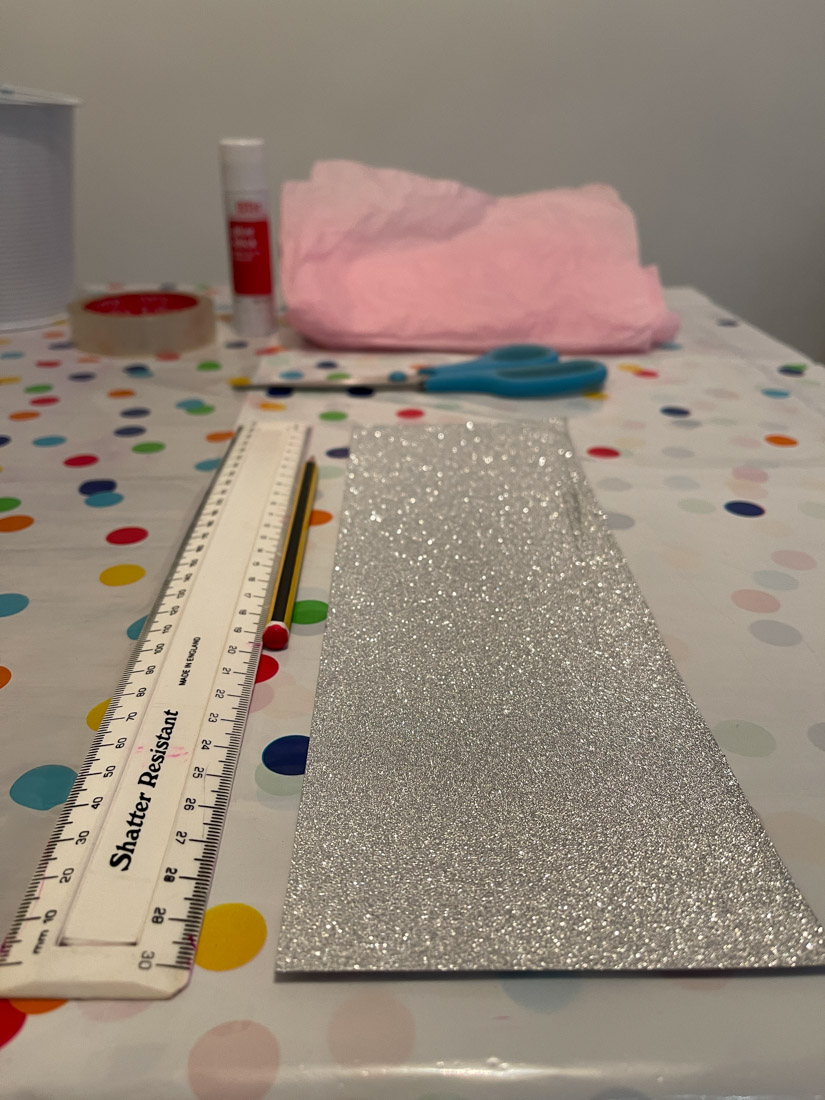 A5 silver glitter card with ruler on craft table