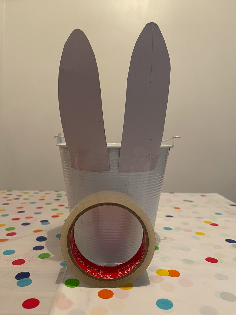 Easter bunny years taped to a bucket and tape roll